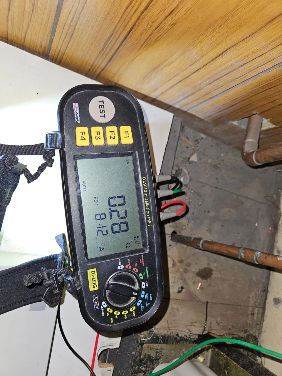 Diagnostic tester beside pipework