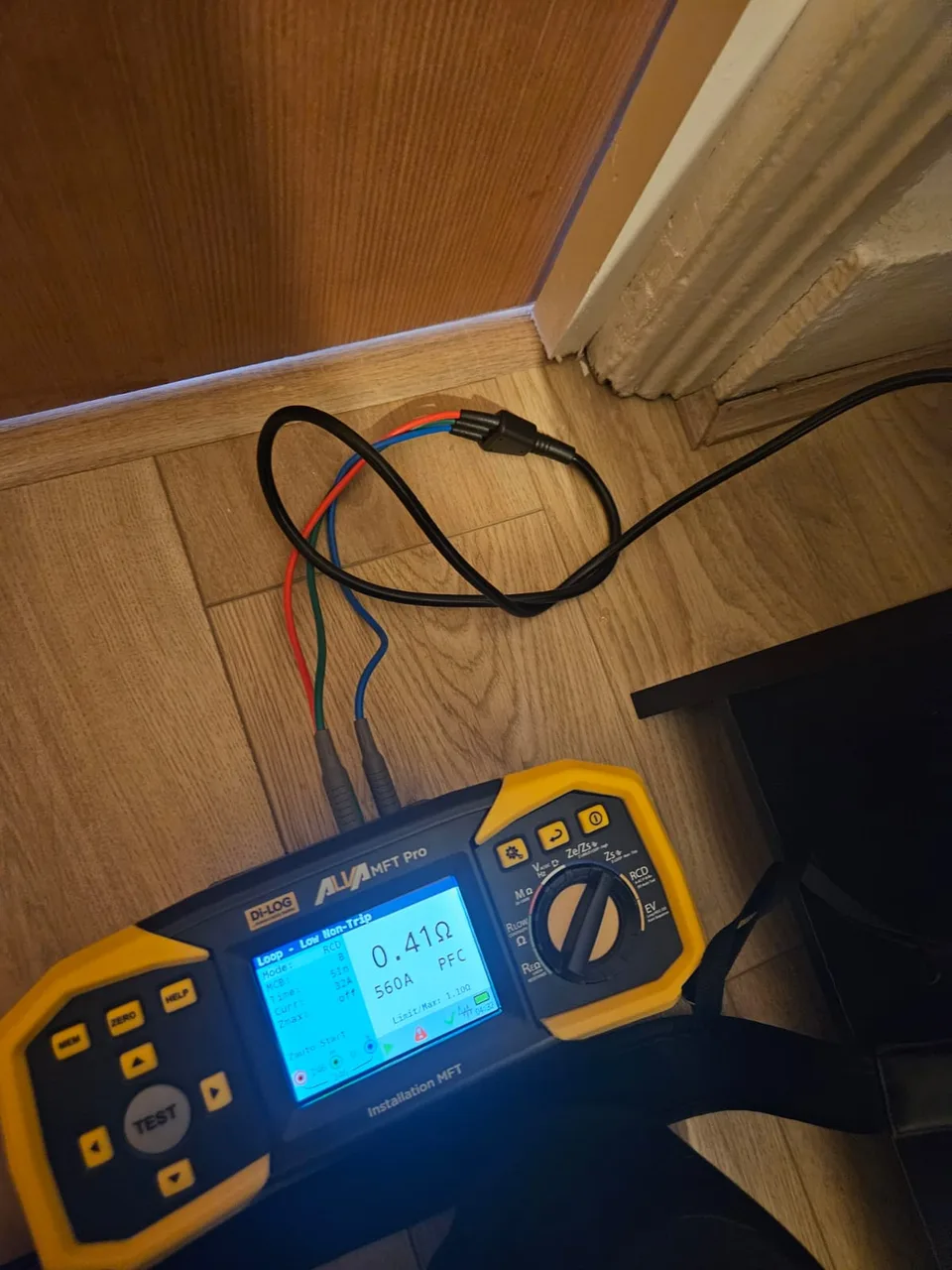 Electrical tester with a display and connected test leads