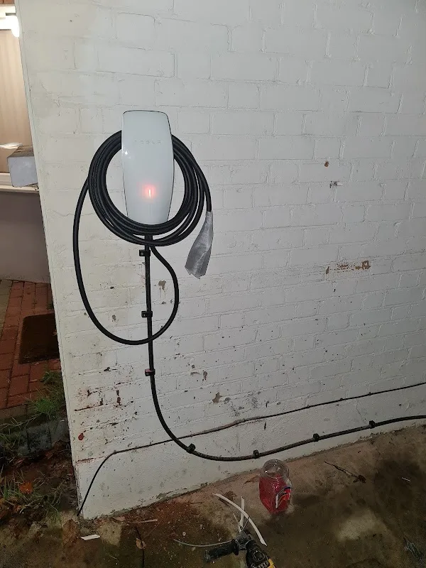 Wall-mounted electric vehicle charger with charging cable