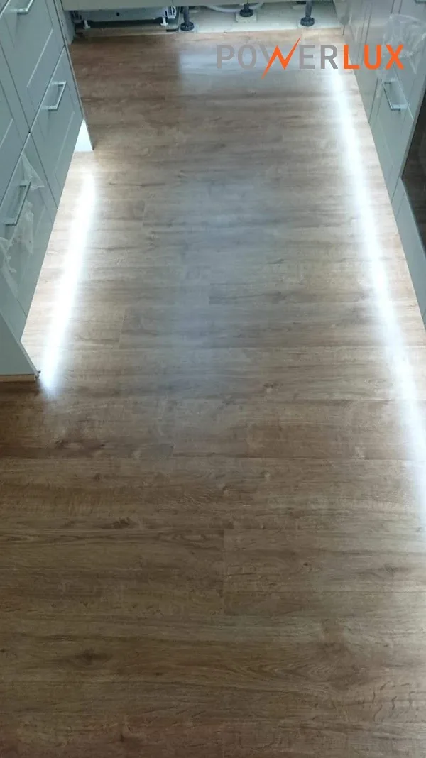 Lighting installed along the base of kitchen cabinets